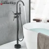 baignoire autoportante îlot noir mat doré chrome robinet sur pied mitigeur double poignée douchette main céramique finition laquée contemporain minimaliste baignoire autoportante îlot noir mat doré chrome robinet sur pied mitigeur double poignée douchette main céramique finition laquée contemporain minimaliste