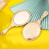 Miroir vintage ovale festonné or rose gravé…