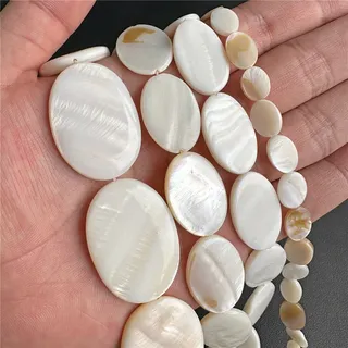 Perles ovales en coquillage naturel pour bijoux