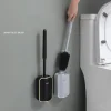 brosse toilettes murale silicone poils denses manche long ergonomique support mural compact rectangulaire arrondis finition mate tete amovible