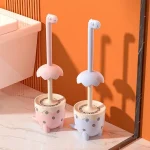 brosse toilette dinosaure kawaii pastel rose bleu manche ergonomique tete decoratif couvercle antieclaboussures jupe festonnee base stable trois pieds hygiénique