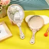 Miroir vintage ovale festonné or rose gravé floral dos… – vue 2