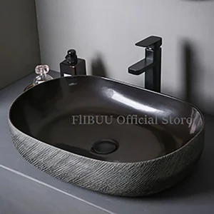 Vasque céramique ovale profonde minimaliste contemporaine texturée effet pierre grise intérieur émaillé noir brillant bonde centrale durable entretien facile