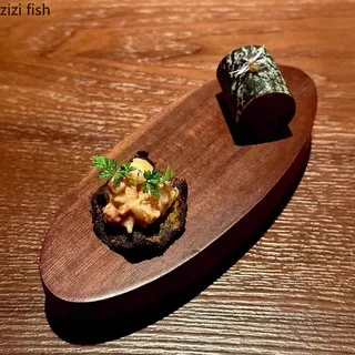 Assiette ovale en bois de noyer Dim Sum