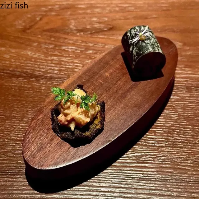Assiette ovale en bois de noyer Dim Sum