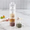 pots épices empilables modulaires cylindriques acrylique transparent couvercles blancs vissables hermétiques compacts empilage identification immédiate placard plan travail rangement cuisine