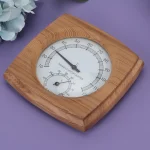 thermohygrometre analogique interieur double cadran grand rond lecture instantanee bois cedre resistant hautes temperatures corrosion durable compact rustique minimaliste decoratif