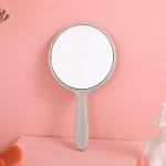 miroir maquillage portable poignée ergonomique rond petit antichute ABS finition mate léger compact poche retouche beauté rose vert bleu blanc